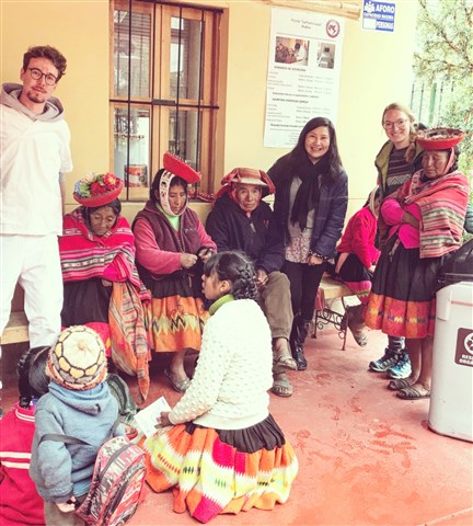 Florian Schilling (in white clothing) during his humanitarian mission in Peru.